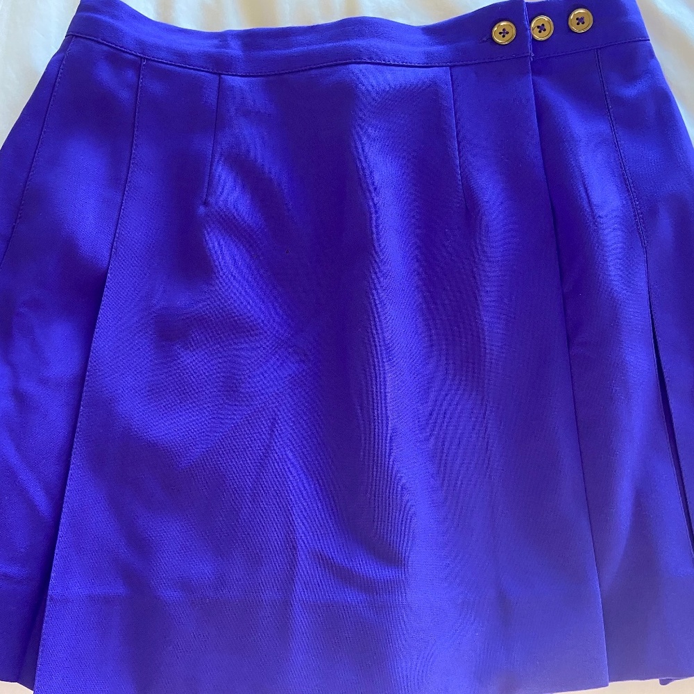 Chic purple tennis skirt with gold button detail